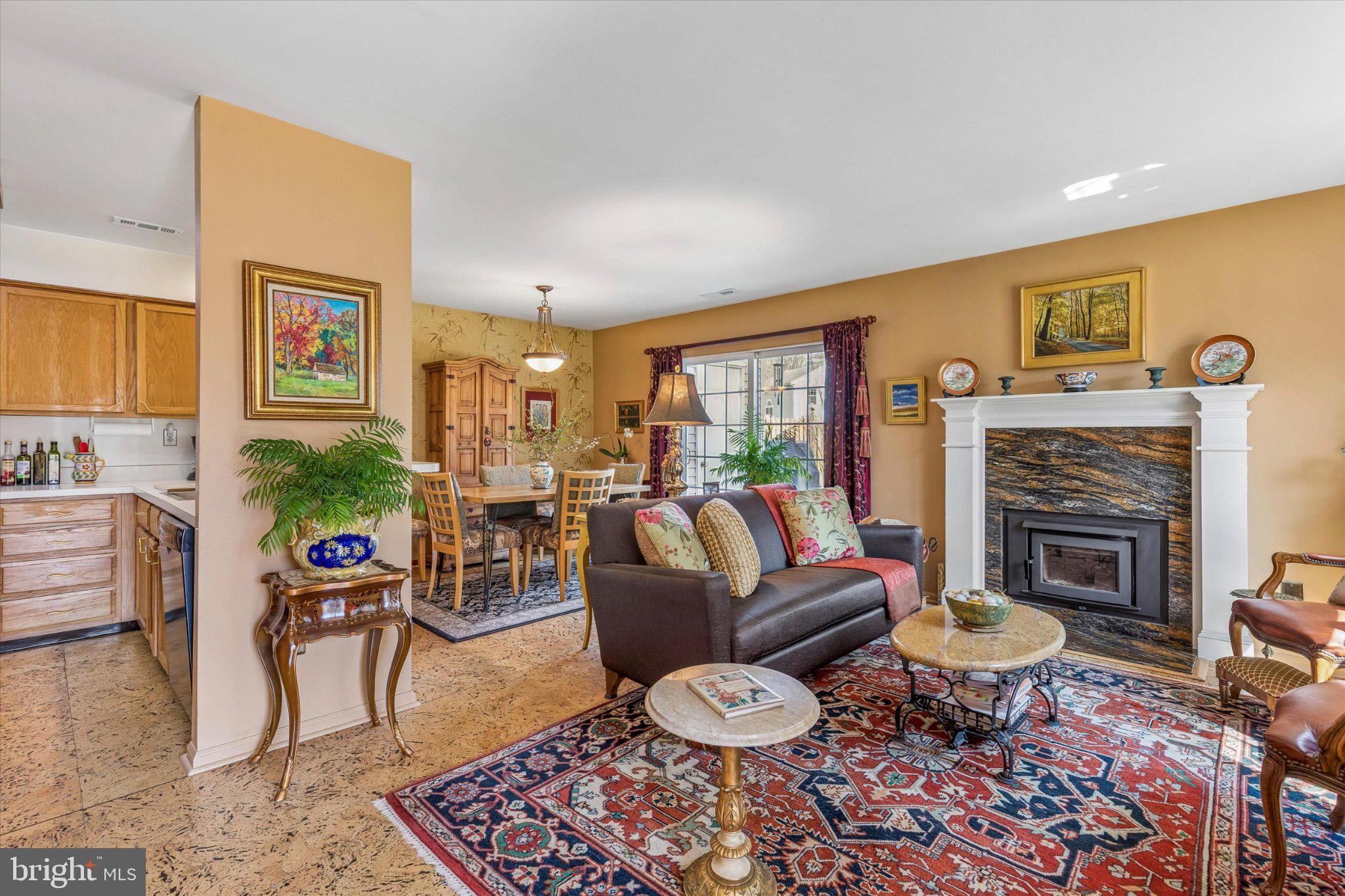 107 Carousel Circle Doylestown, PA 18901 - Photo 7 of 31 a living room with furniture a rug a fireplace and a flat screen tv