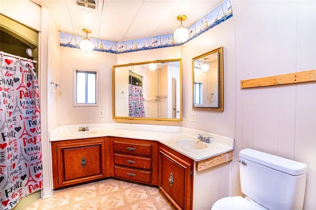 a view of a big room with windows