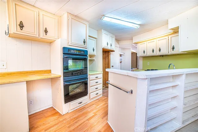 a bathroom with a sink a vanity and a bathtub