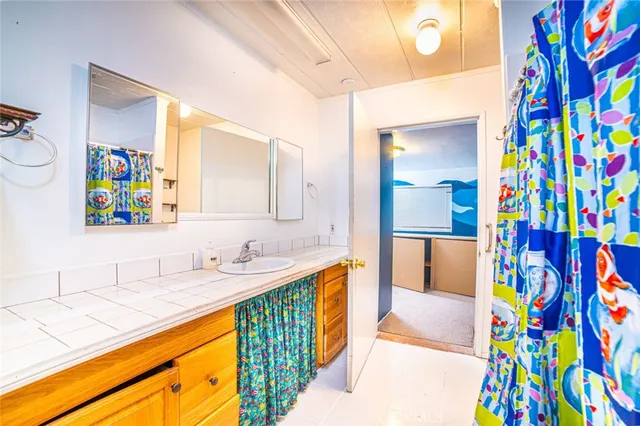 a room that has a bed and a chandelier