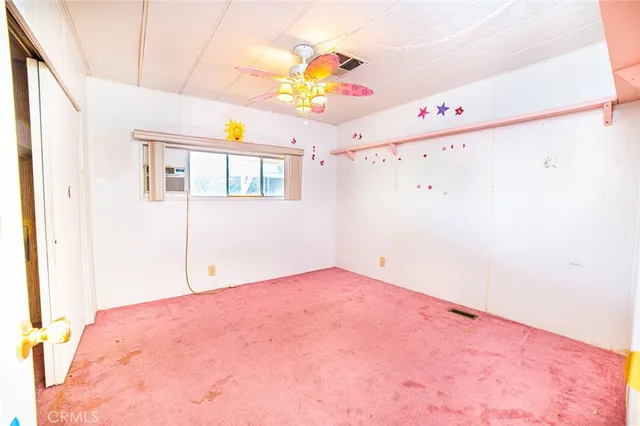 a view of a livingroom with a projector and furniture