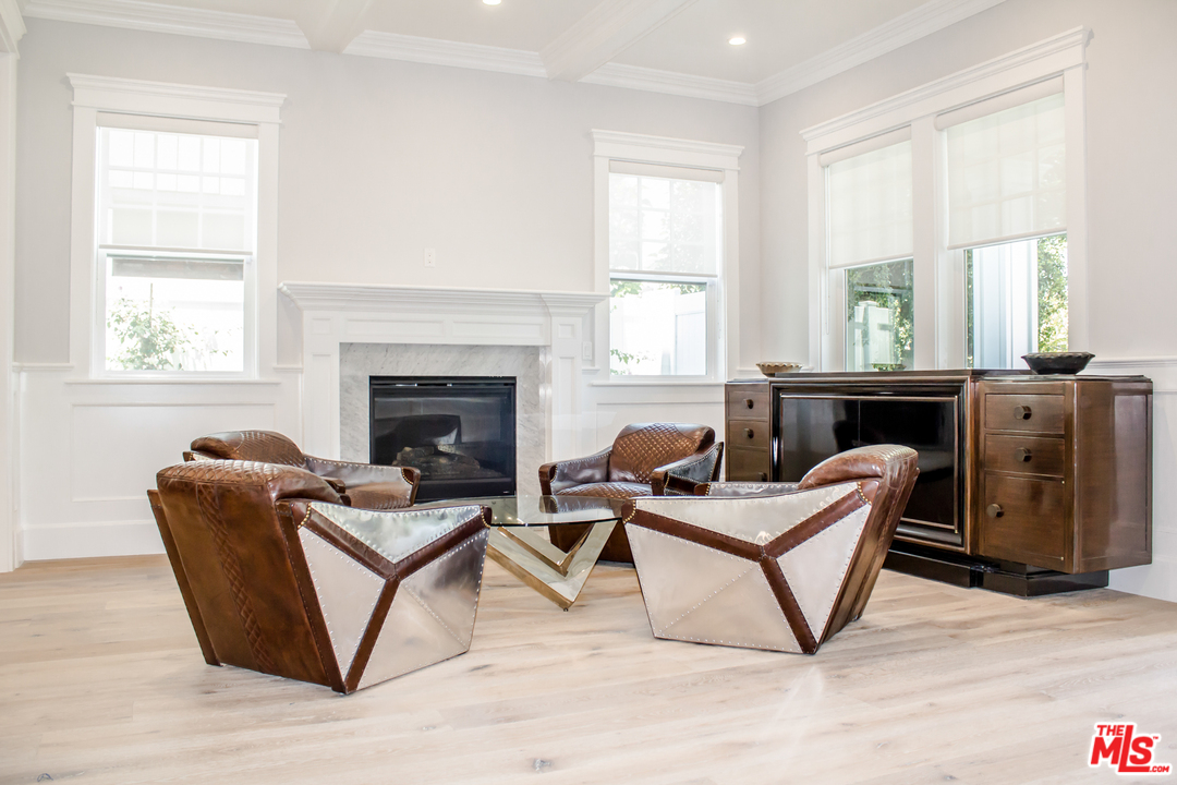 15714 Morrison Street Encino, CA 91436 - Photo 12 of 49 a living room with furniture and a fireplace