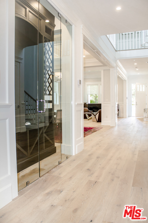 15714 Morrison Street Encino, CA 91436 - Photo 18 of 49 a view of a hallway with wooden shelves