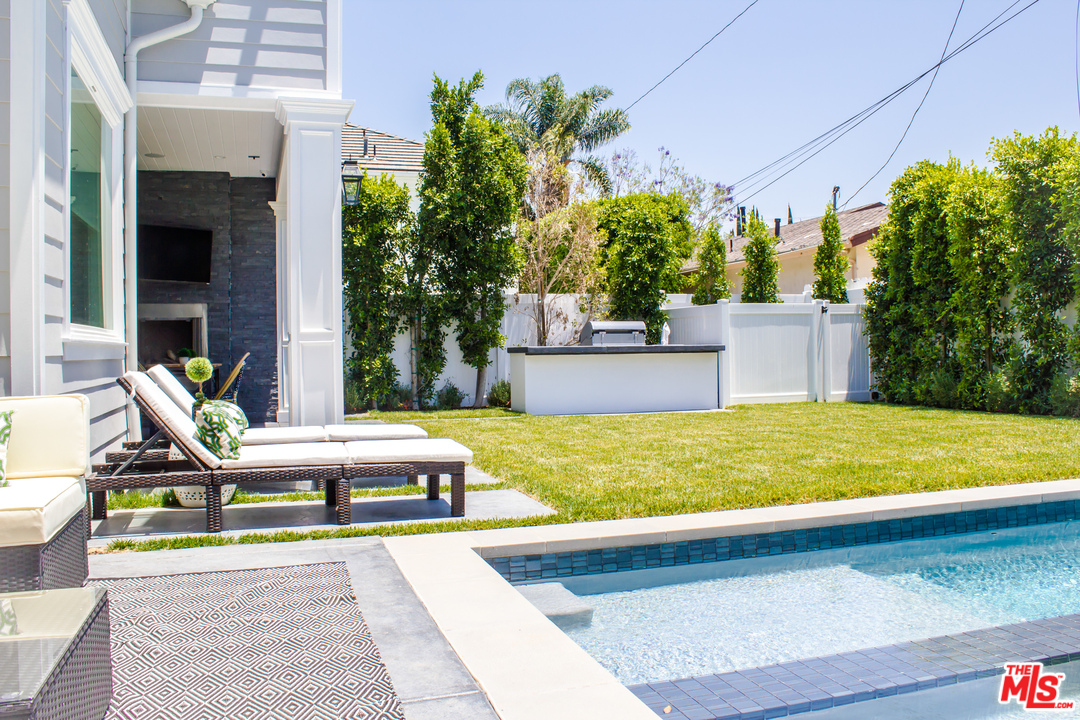 15714 Morrison Street Encino, CA 91436 - Photo 2 of 49 a view of an house with swimming pool