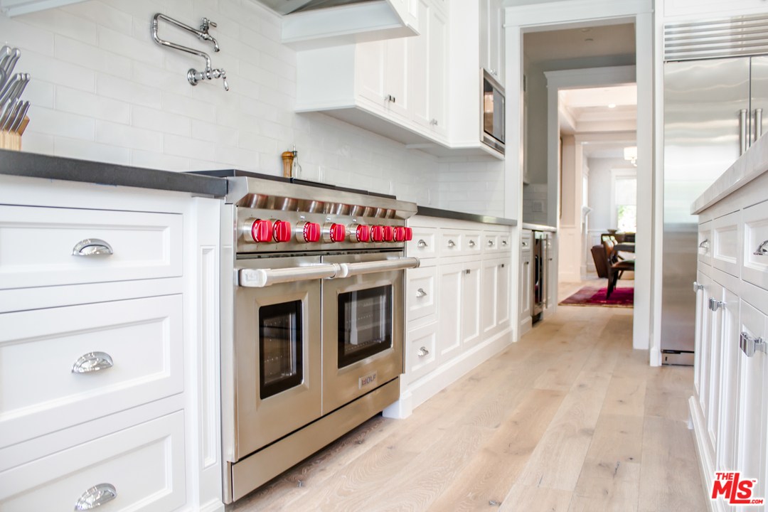 15714 Morrison Street Encino, CA 91436 - Photo 21 of 49 a utility room with a washer and dryer