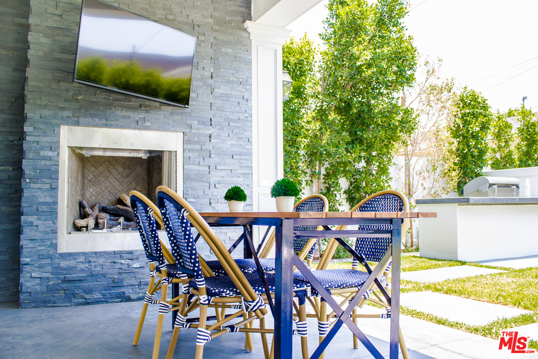 15714 Morrison Street Encino, CA 91436 - Photo 27 of 49 a view of an outdoor space with a table and chairs