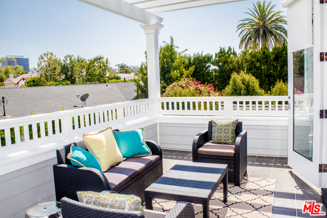 15714 Morrison Street Encino, CA 91436 - Photo 34 of 49 a view of a chairs and table in patio