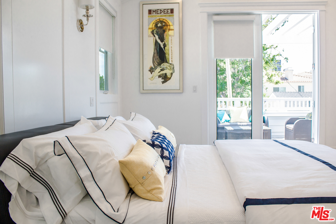 15714 Morrison Street Encino, CA 91436 - Photo 37 of 49 a bedroom with a bed and a window