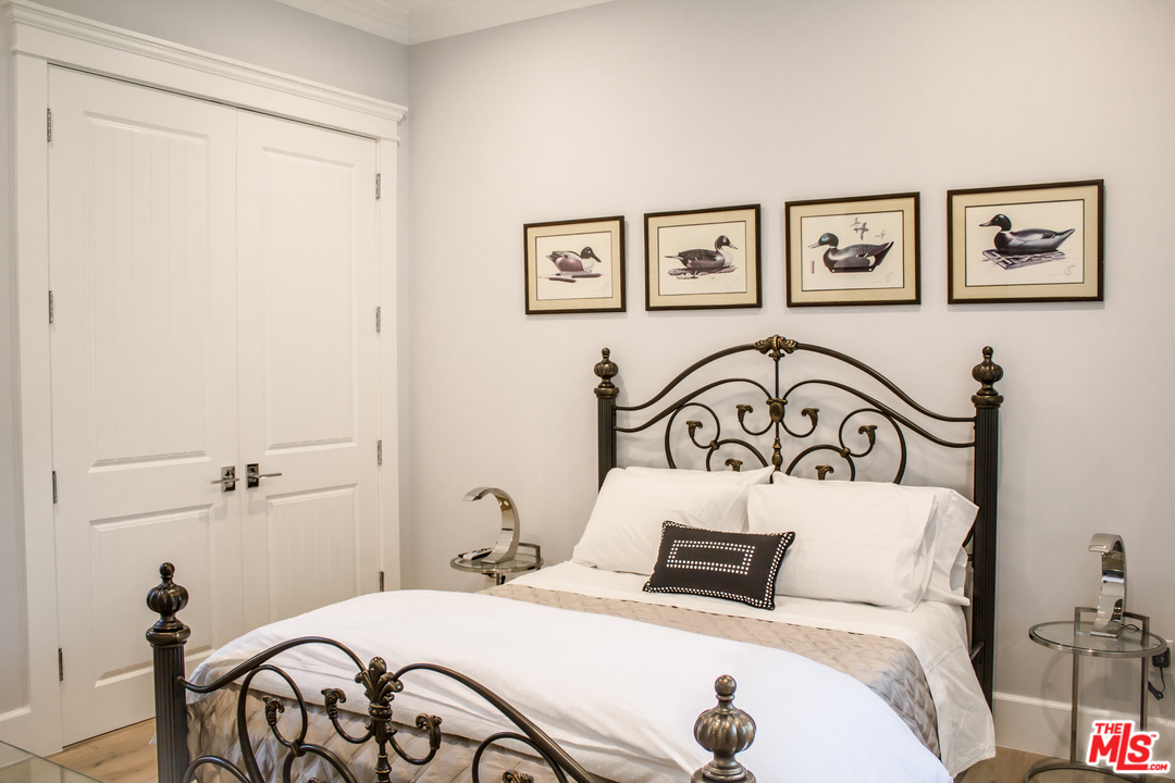 15714 Morrison Street Encino, CA 91436 - Photo 45 of 49 a bedroom with a bed and a table