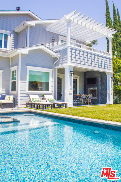 15714 Morrison Street Encino, CA 91436 - Photo 48 of 49 a view of a house with swimming pool and a large window