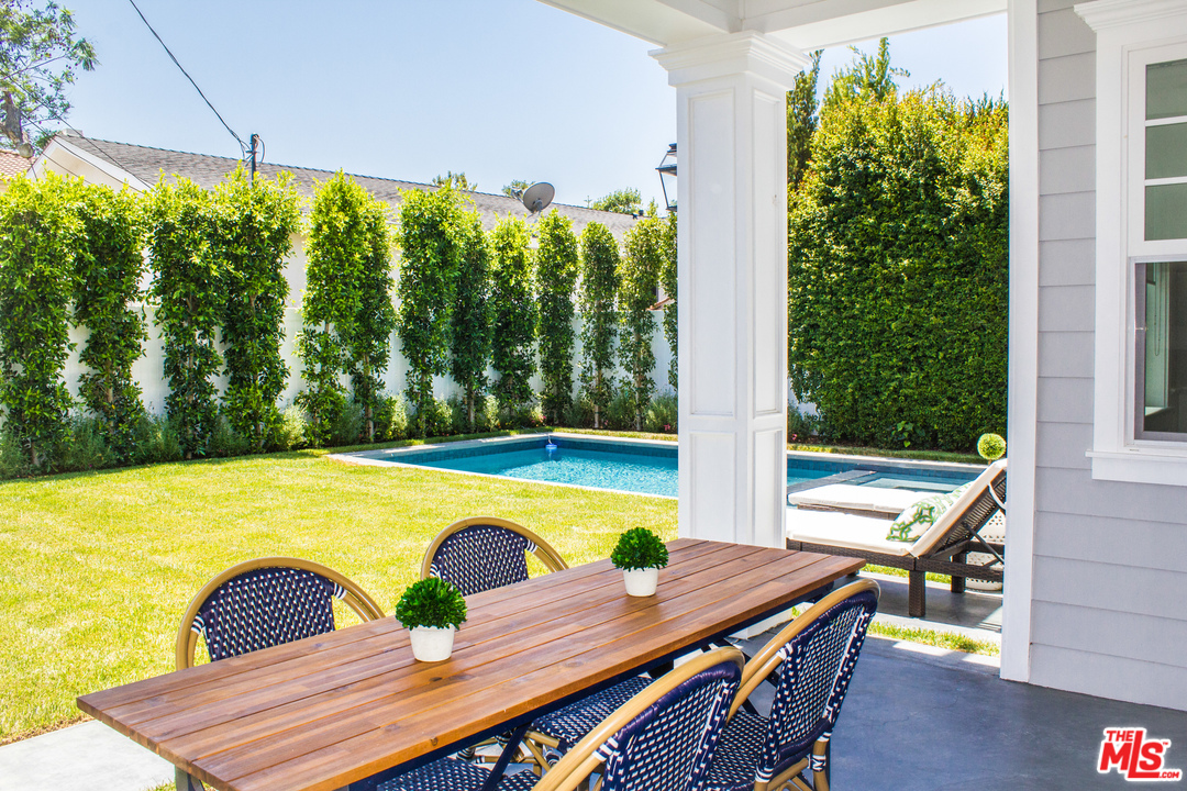 15714 Morrison Street Encino, CA 91436 - Photo 6 of 49 a view of a chairs and table in patio