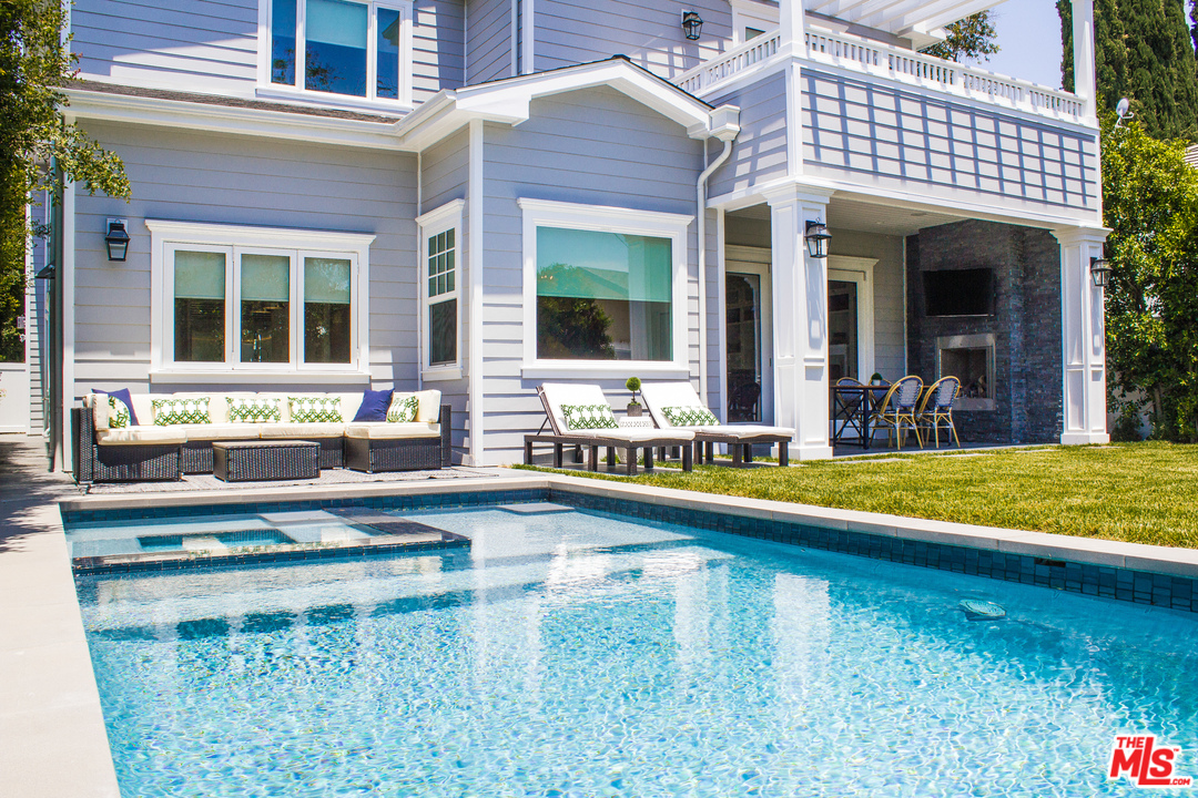 15714 Morrison Street Encino, CA 91436 - Photo 7 of 49 a view of a house with swimming pool and sitting area
