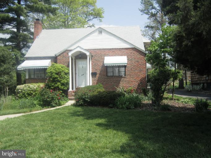 634 Murdock Road Baltimore, MD 21212 - Photo 1 of 23 a view of a white house next to a yard and trees