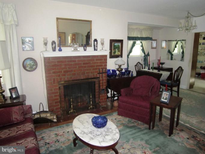 634 Murdock Road Baltimore, MD 21212 - Photo 2 of 23 a living room with furniture and a fireplace