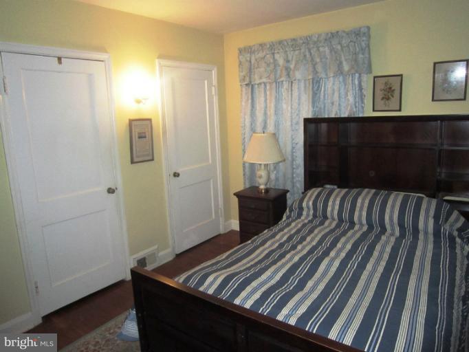 634 Murdock Road Baltimore, MD 21212 - Photo 11 of 23 a bedroom with a bed and a night stand