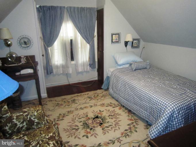 634 Murdock Road Baltimore, MD 21212 - Photo 15 of 23 a bedroom with a large bed and a window