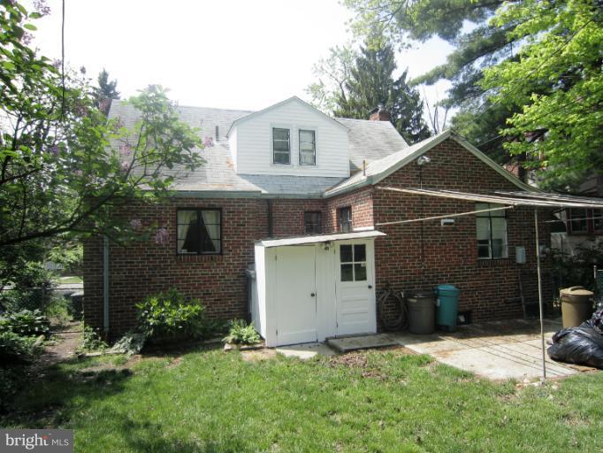 634 Murdock Road Baltimore, MD 21212 - Photo 20 of 23 a view of a white house with a yard and large trees