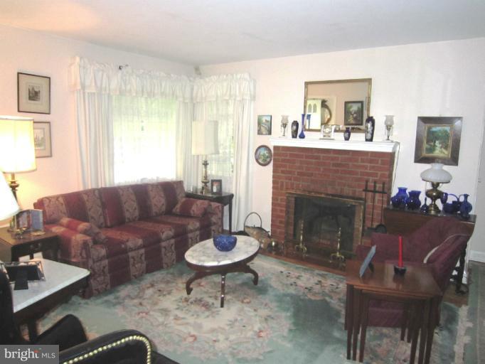 634 Murdock Road Baltimore, MD 21212 - Photo 3 of 23 a living room with furniture and a fireplace