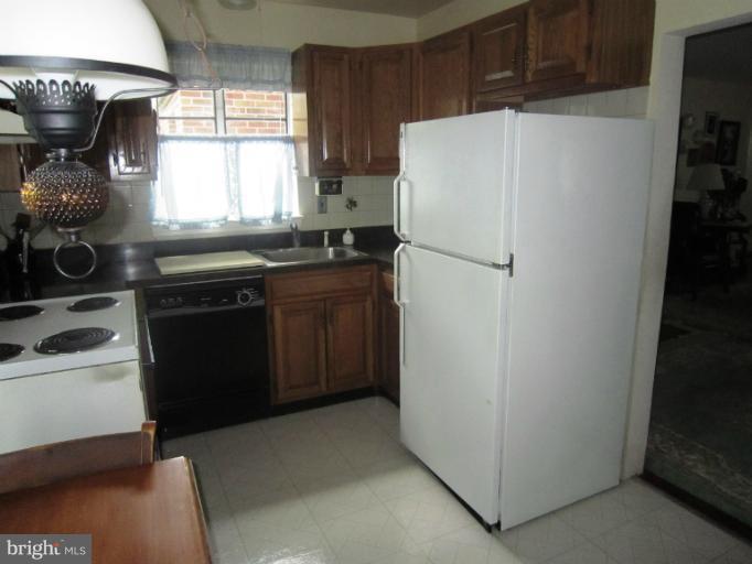 634 Murdock Road Baltimore, MD 21212 - Photo 7 of 23 a white refrigerator freezer sitting inside of a kitchen
