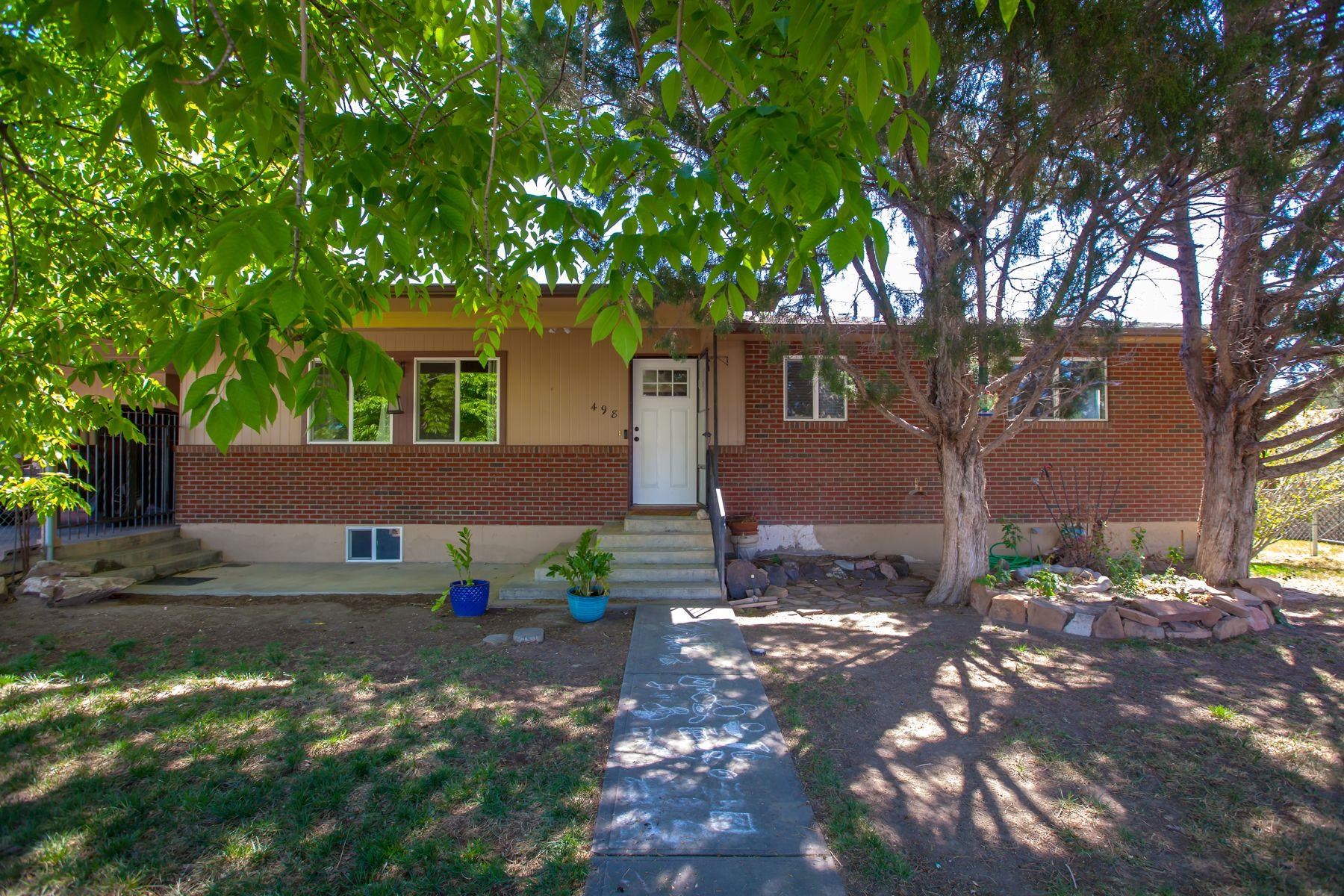 498 Sheldon Road Grand Junction, CO 81504 - Photo 1 of 42 a front view of a house with garden