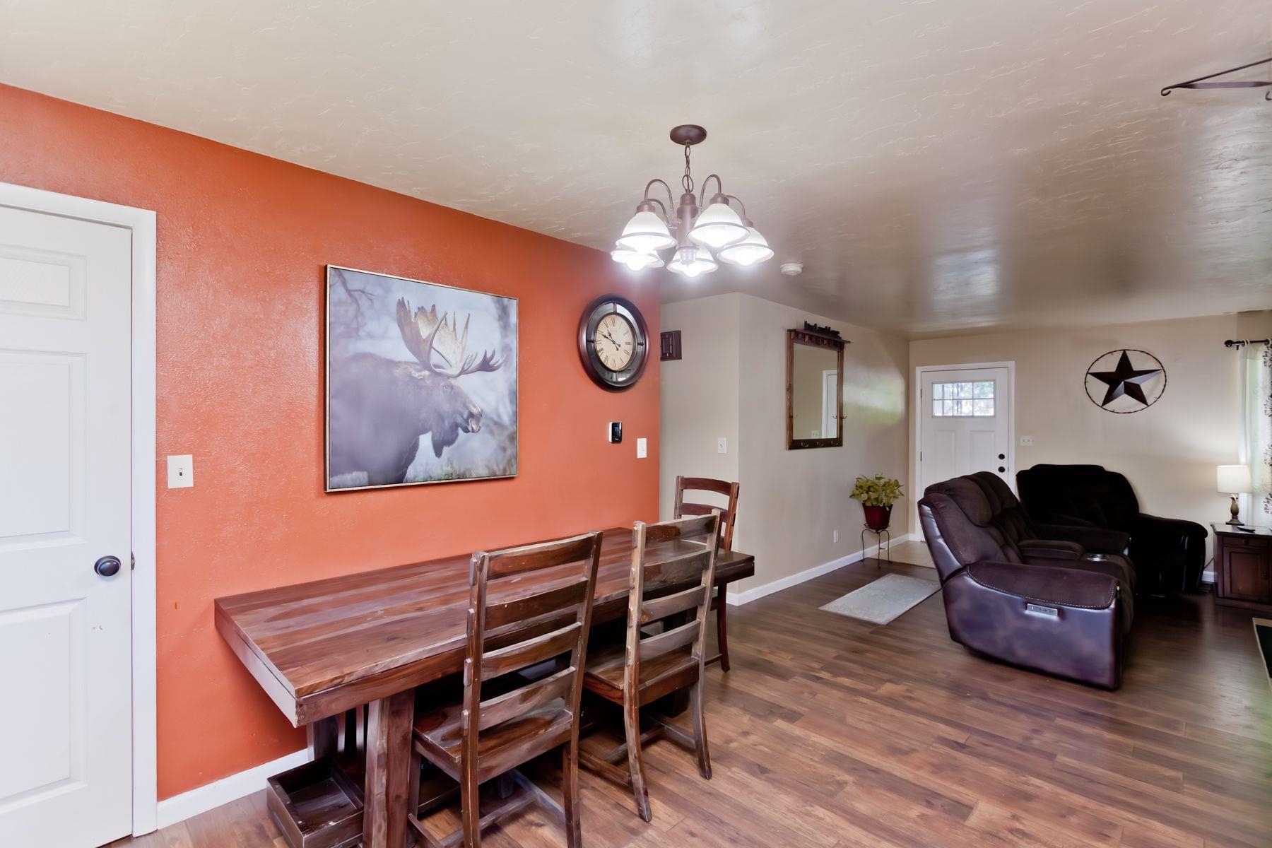 498 Sheldon Road Grand Junction, CO 81504 - Photo 11 of 42 a view of a dining room with furniture and wooden floor