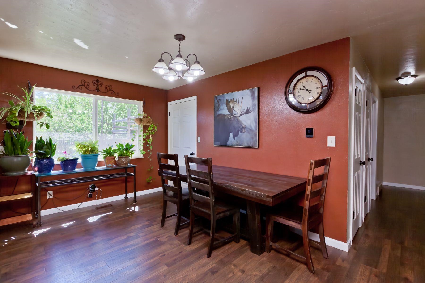 498 Sheldon Road Grand Junction, CO 81504 - Photo 12 of 42 a view of a dining room with furniture window and wooden floor