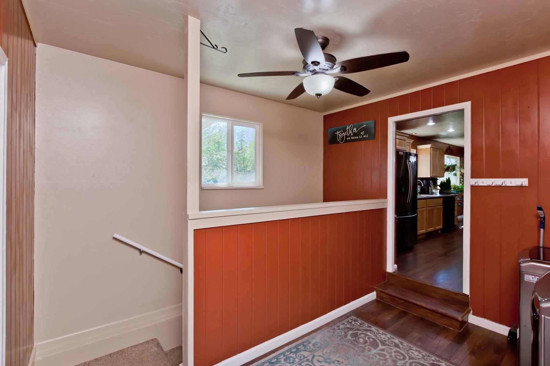 498 Sheldon Road Grand Junction, CO 81504 - Photo 18 of 42 a view of a livingroom with a ceiling fan and a window