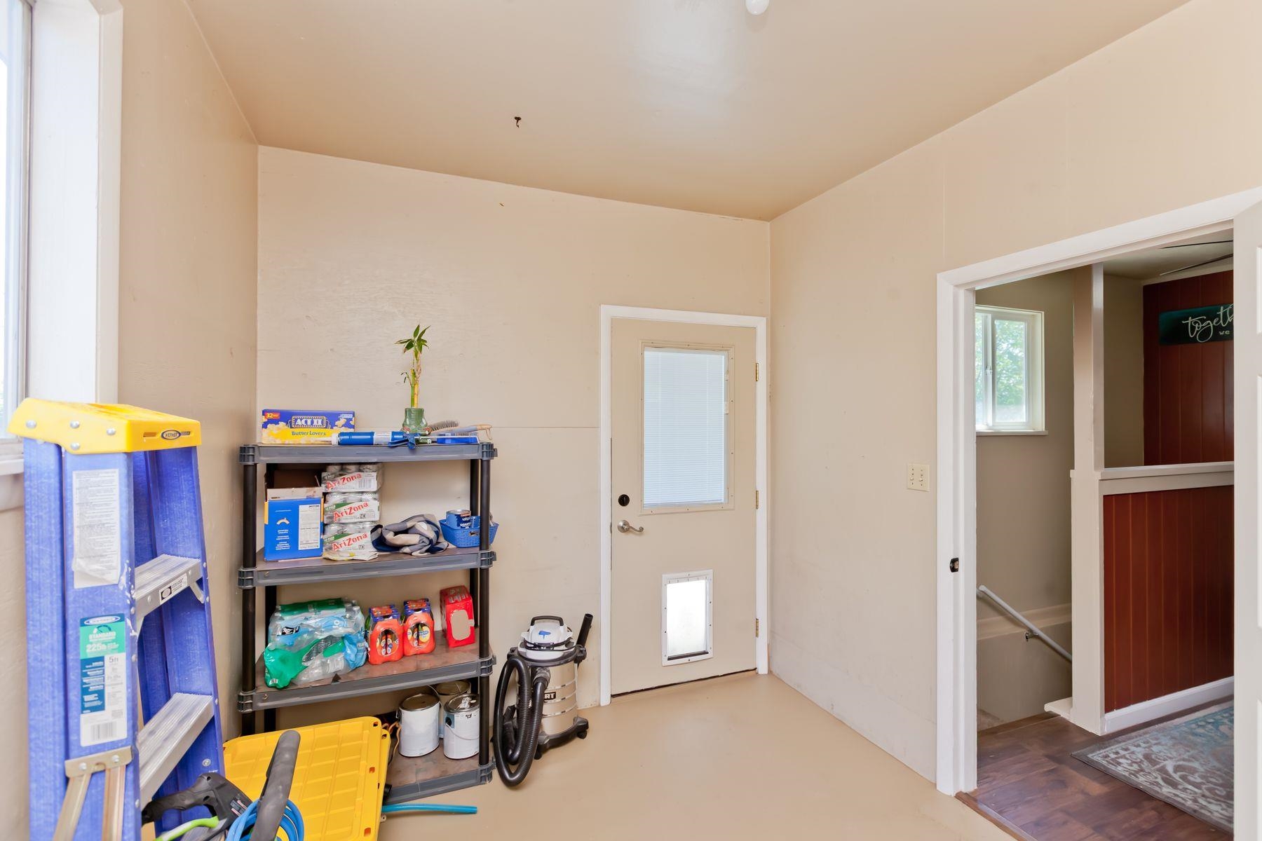 498 Sheldon Road Grand Junction, CO 81504 - Photo 20 of 42 a living room with furniture a baby crib and a window