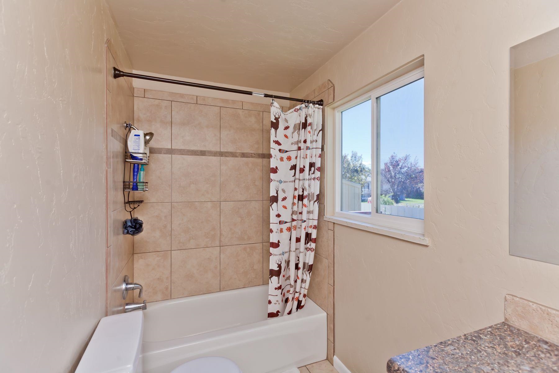 498 Sheldon Road Grand Junction, CO 81504 - Photo 25 of 42 a bathroom with a bathtub and a shower
