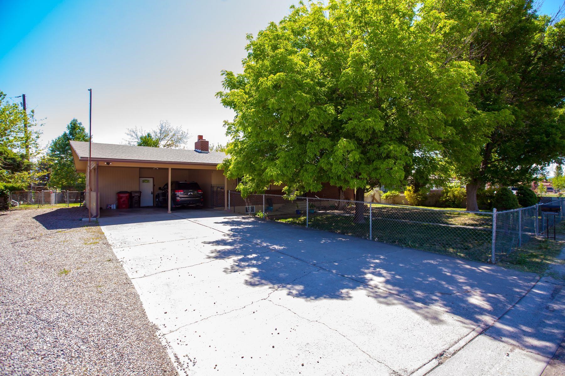 498 Sheldon Road Grand Junction, CO 81504 - Photo 3 of 42 a view of house with backyard and a garden