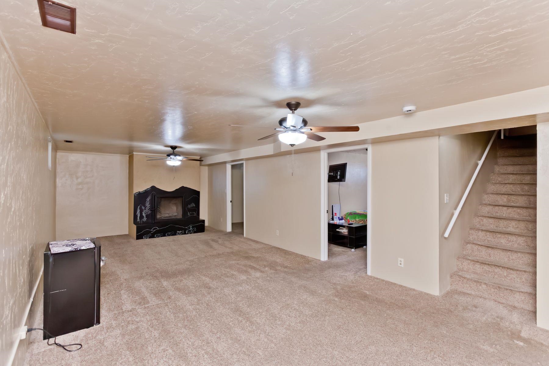 498 Sheldon Road Grand Junction, CO 81504 - Photo 34 of 42 wooden floor in an empty room with a fireplace