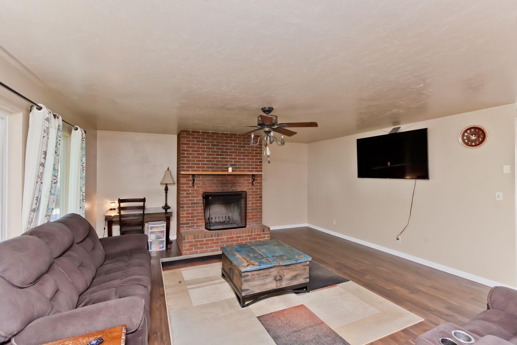 498 Sheldon Road Grand Junction, CO 81504 - Photo 6 of 42 a living room with furniture and a fireplace