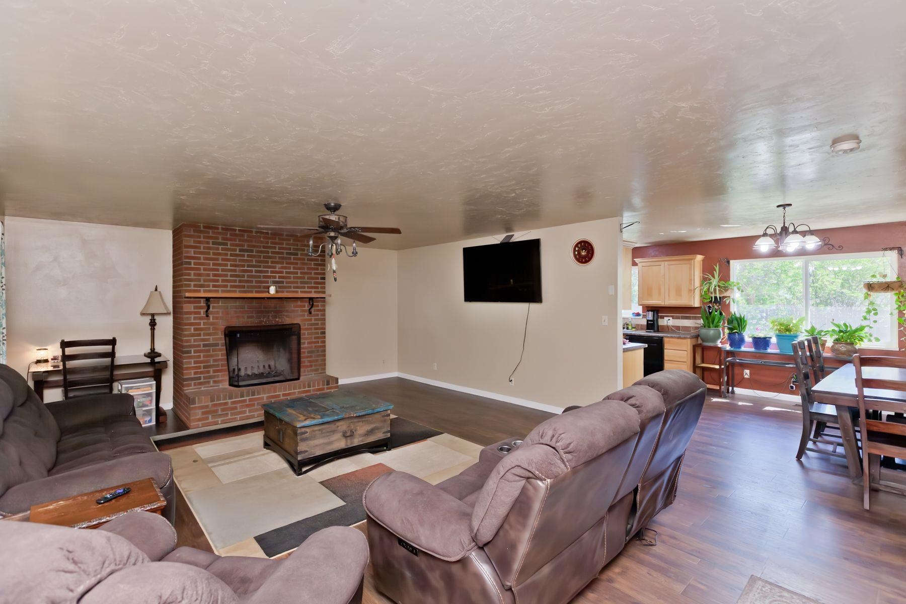 498 Sheldon Road Grand Junction, CO 81504 - Photo 7 of 42 a living room with furniture and a fireplace