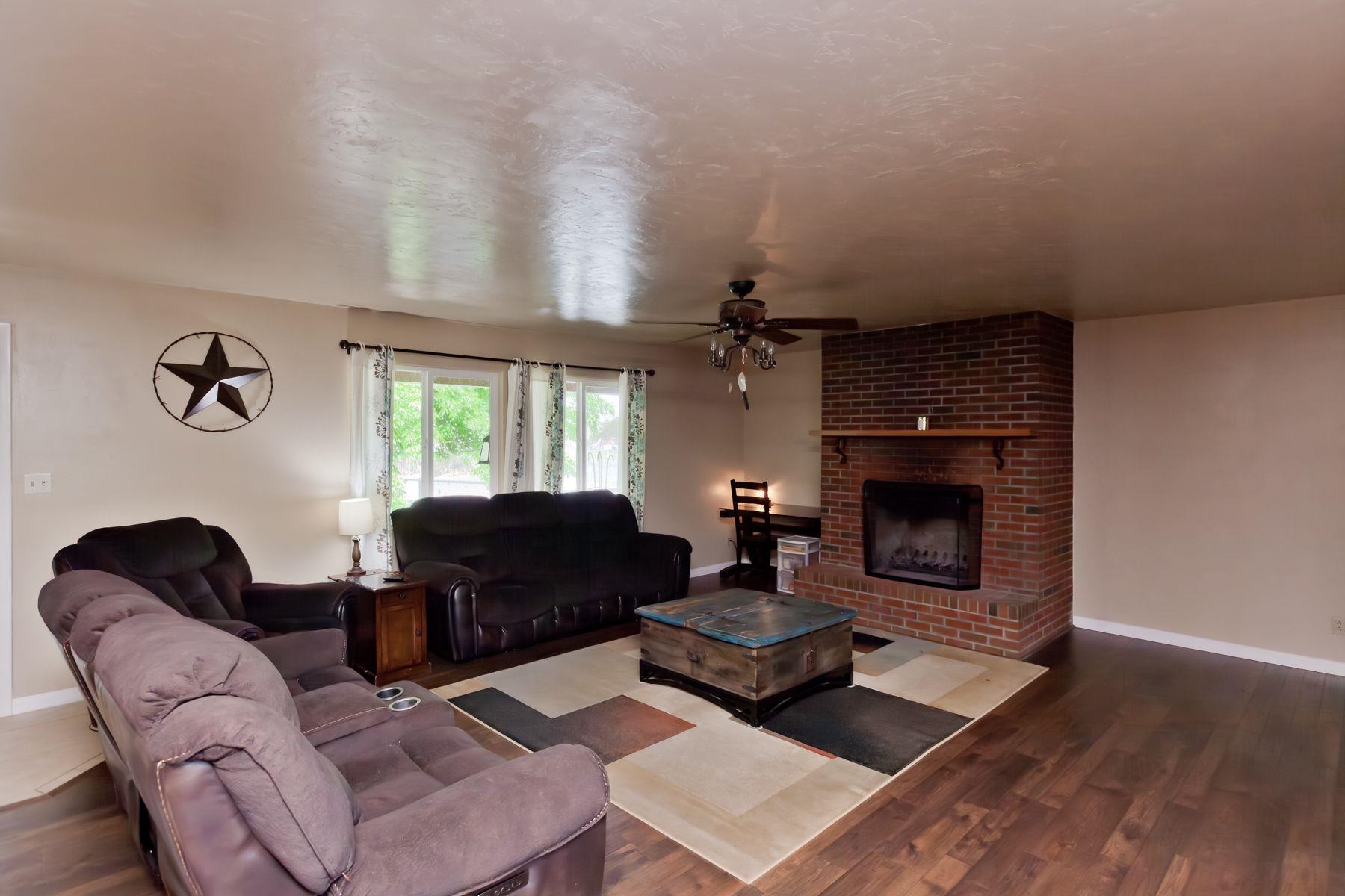 498 Sheldon Road Grand Junction, CO 81504 - Photo 10 of 42 a living room with furniture and a fireplace