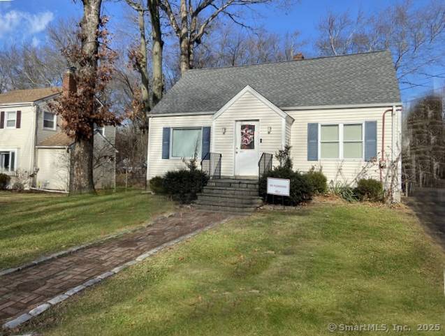 a front view of a house with a yard