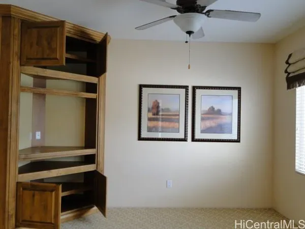 a living room with a piano and a window