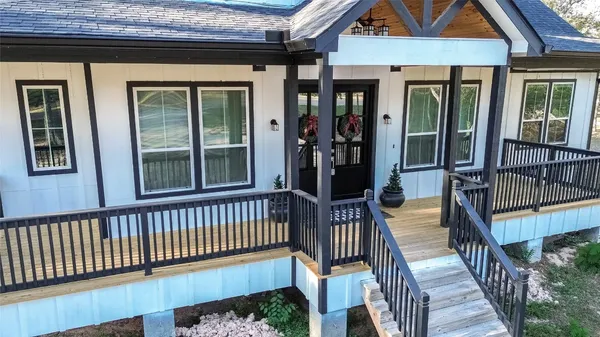 a front view of a house with a porch