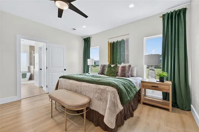 a bed room with a bed and a chair