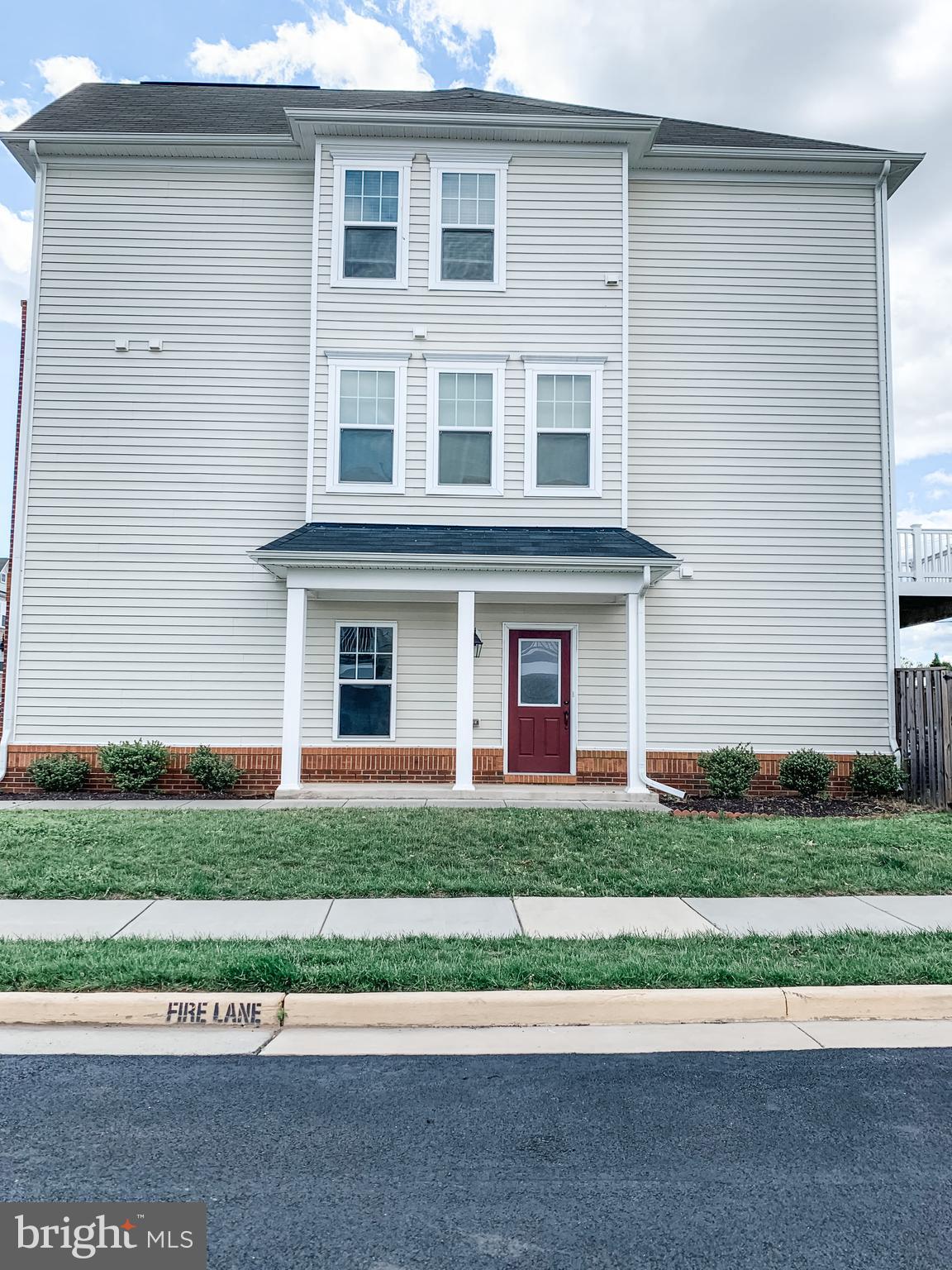 43322 Novi Terrace Ashburn, VA 20147 - Photo 2 of 19 a front view of a house with a yard