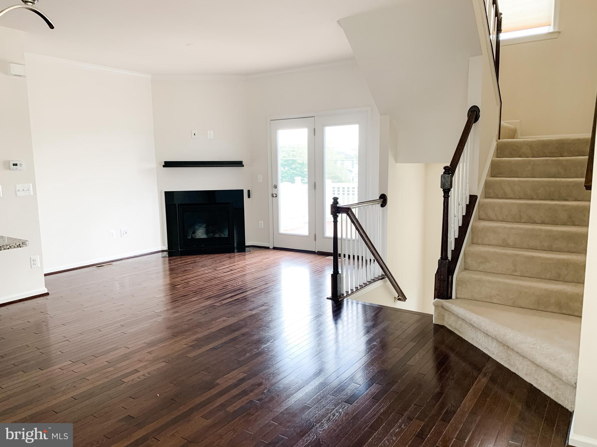 43322 Novi Terrace Ashburn, VA 20147 - Photo 13 of 19 a view of an empty room with wooden floor and a window