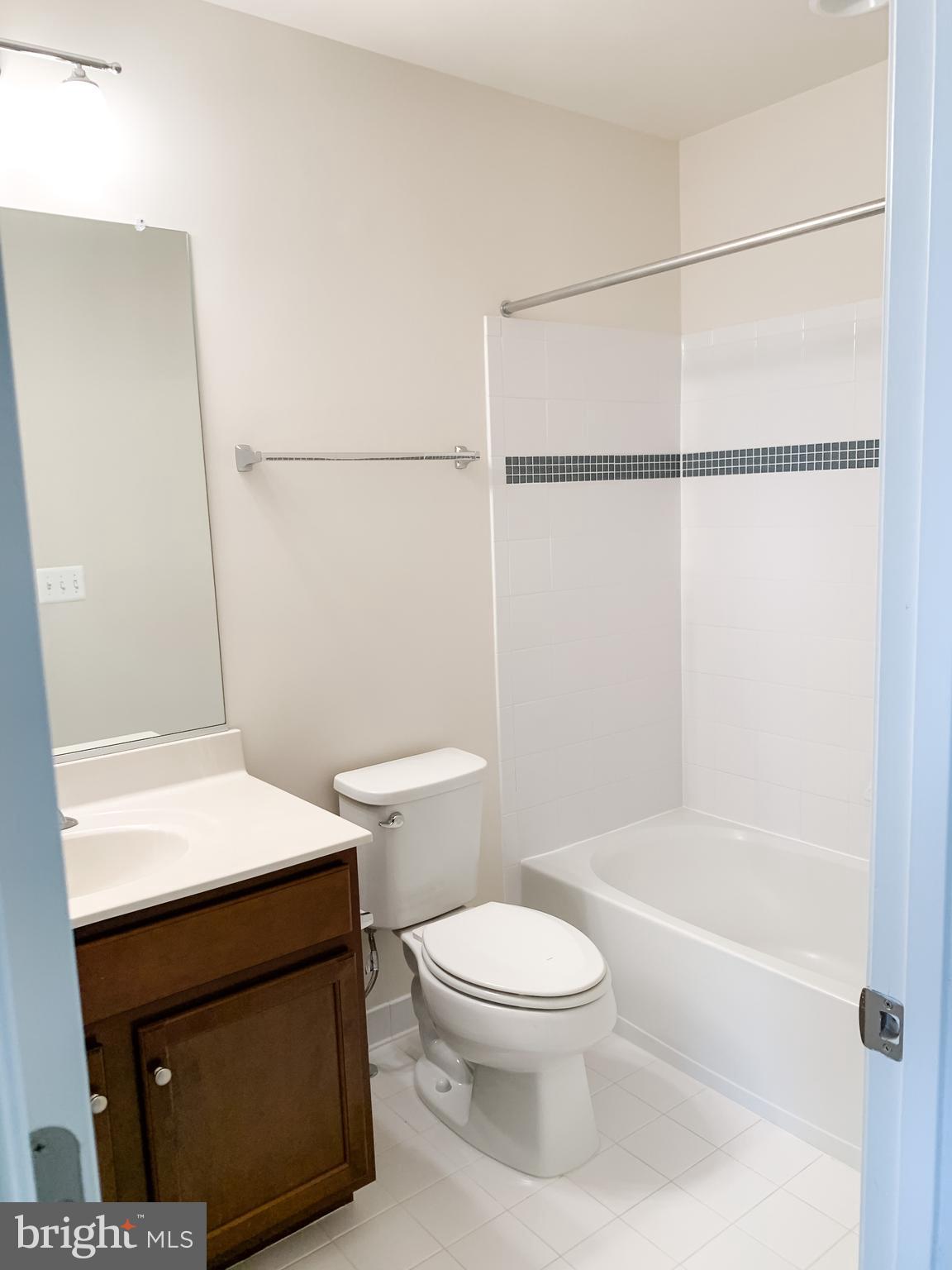 43322 Novi Terrace Ashburn, VA 20147 - Photo 19 of 19 a bathroom with a toilet a sink and a shower