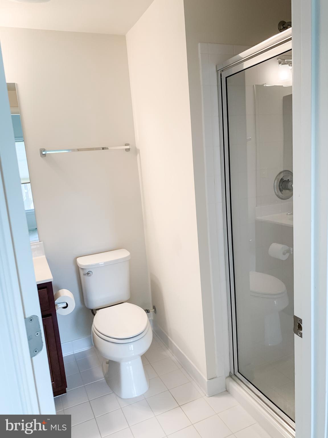 43322 Novi Terrace Ashburn, VA 20147 - Photo 4 of 19 a white toilet sitting next to a bathroom sink