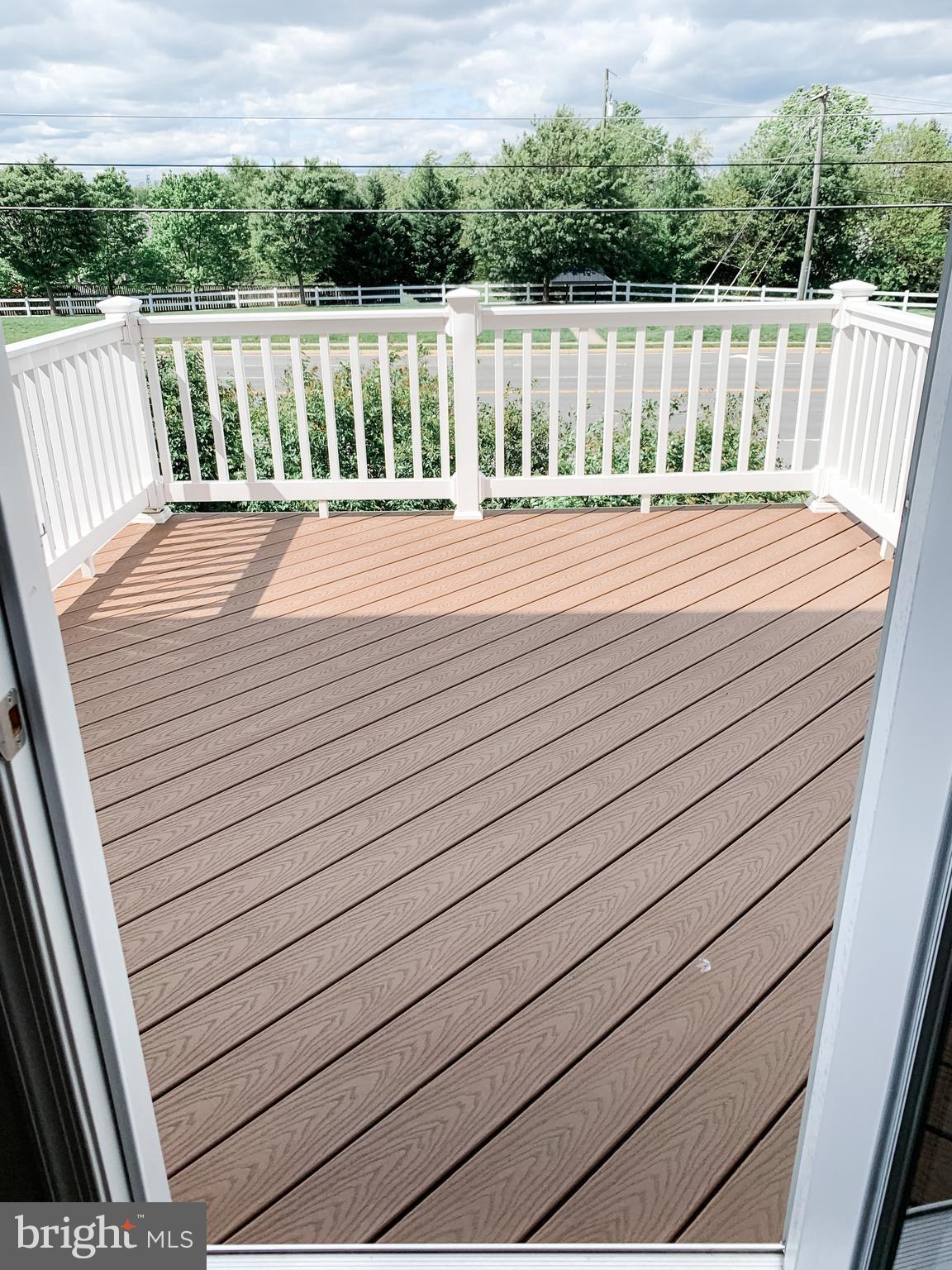 43322 Novi Terrace Ashburn, VA 20147 - Photo 8 of 19 a balcony with wooden floor