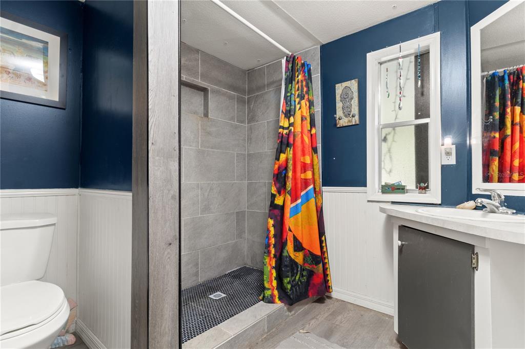 3650 176 Place Inglis, FL 34449 - Photo 23 of 49 a bathroom with a sink and a mirror