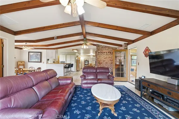 a living room with lots of furniture and a rug