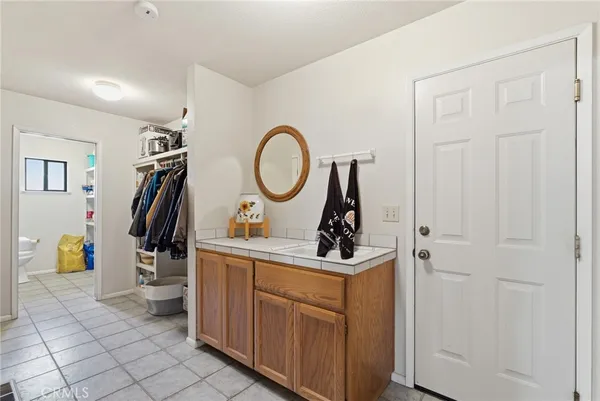 a white toilet sitting next to a shower curtain