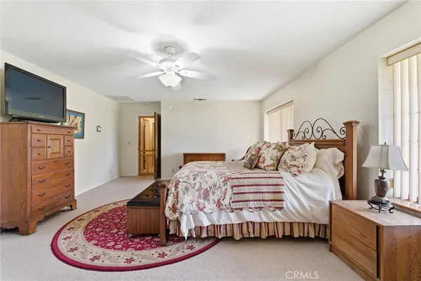 a bathroom with a double vanity sink a toilet and a mirror