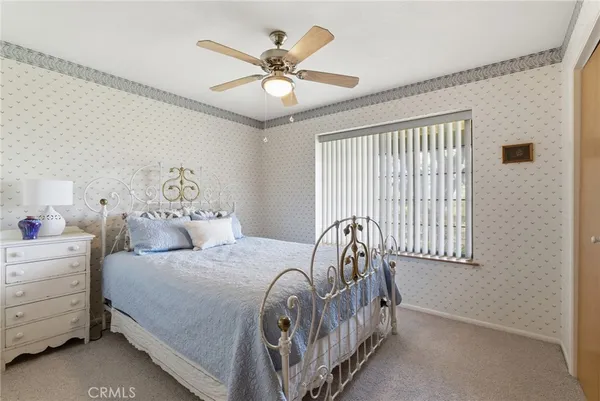 a view of a house with backyard porch and sitting area