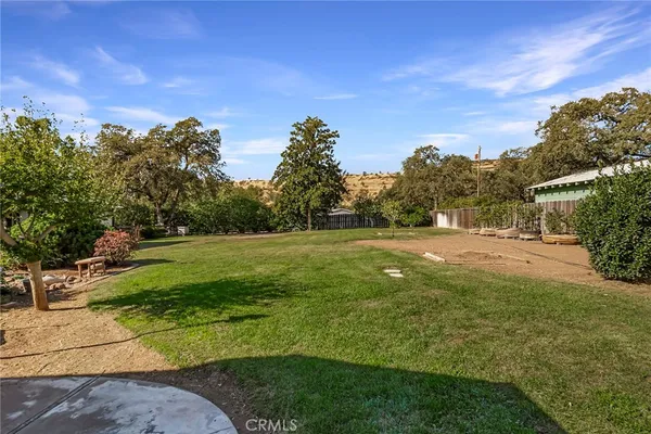 a view of a backyard with sitting area