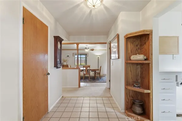 a living room with furniture and large windows
